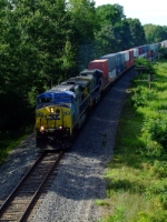 A backlit CSX 9 heads through Guilderland on the way to Selkirk